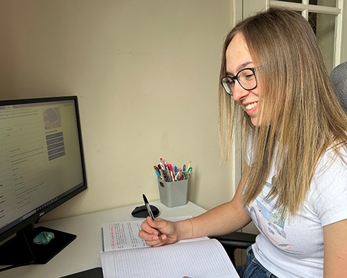 Lauren Harrison working on flood risk secondment at her desk