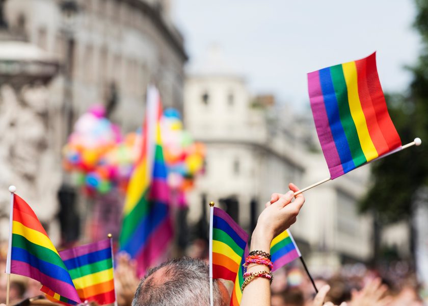 Pride celebration with people waving flags