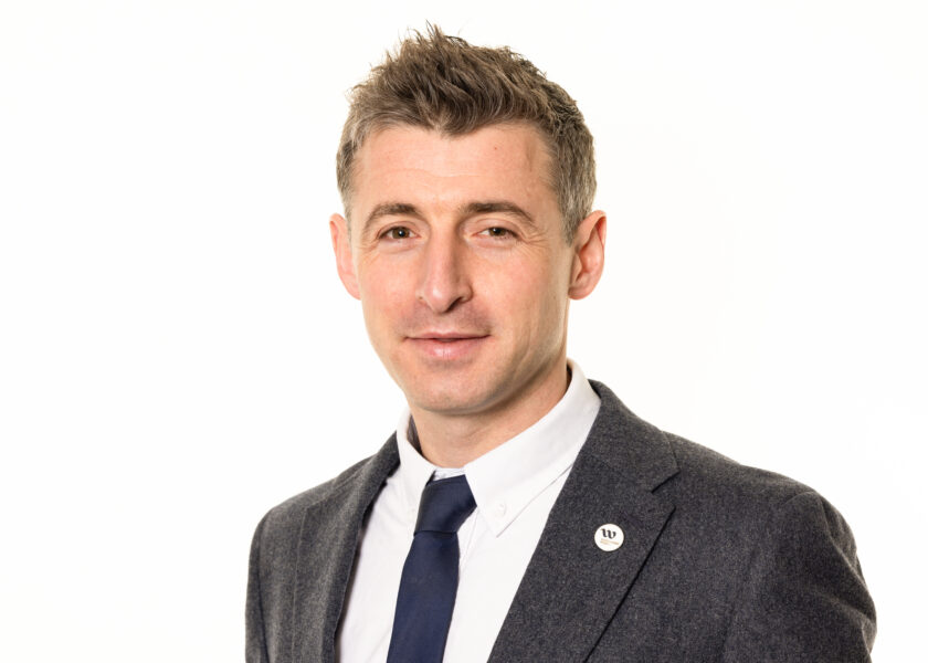 Josh Wilce wearing a WA suit